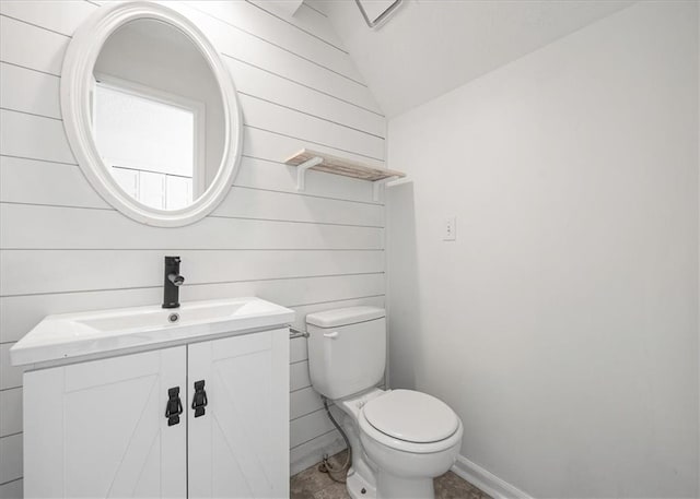 1467 E Orleans Dr, Olathe, KS 66062 - half bath with vanity, lofted ceiling, and wood walls