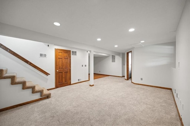 1467 E Orleans Dr, Olathe, KS 66062 - finished below grade area featuring carpet, recessed lighting, stairway, and electric panel