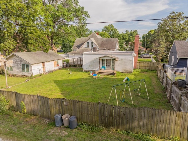 708 Osage St, Neodesha, KS 66757 - fenced backyard featuring a playground