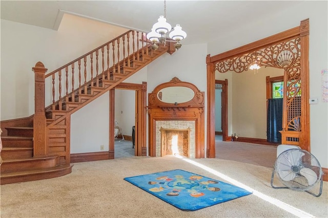 708 Osage St, Neodesha, KS 66757 - staircase featuring carpet floors, a chandelier, and a tiled fireplace