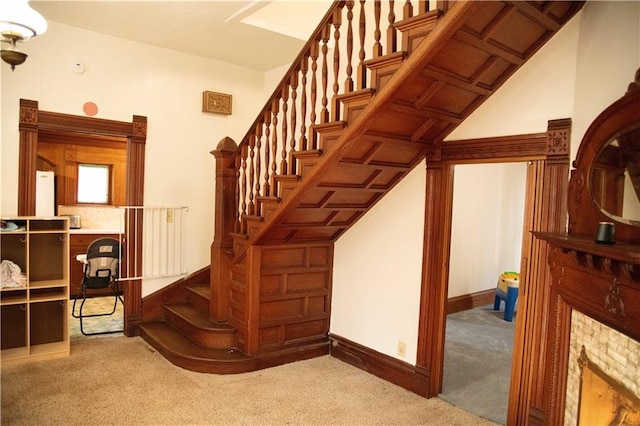 708 Osage St, Neodesha, KS 66757 - stairs with carpet floors and baseboards