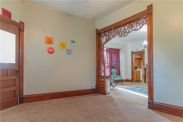708 Osage St, Neodesha, KS 66757 - hallway with carpet flooring and baseboards
