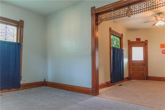 708 Osage St, Neodesha, KS 66757 - carpeted spare room featuring a ceiling fan and baseboards