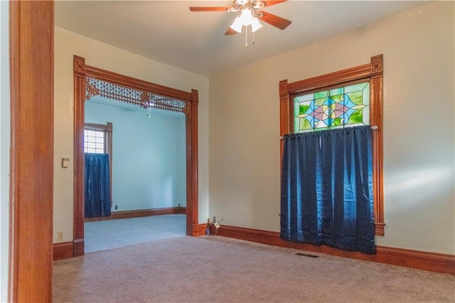 708 Osage St, Neodesha, KS 66757 - carpeted spare room with a ceiling fan and baseboards