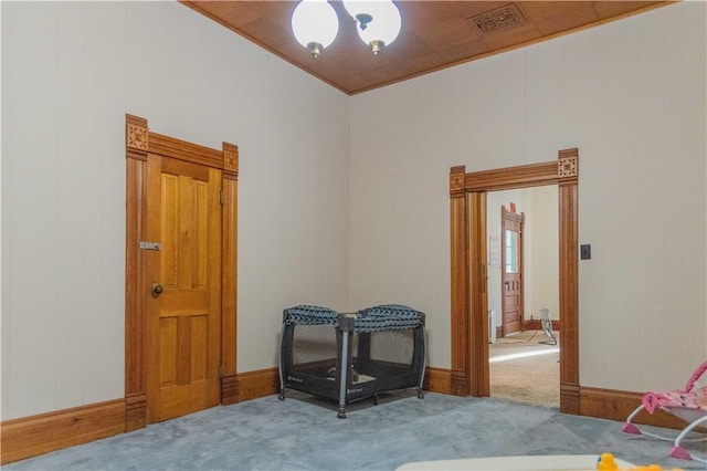 708 Osage St, Neodesha, KS 66757 - bedroom with carpet and a chandelier