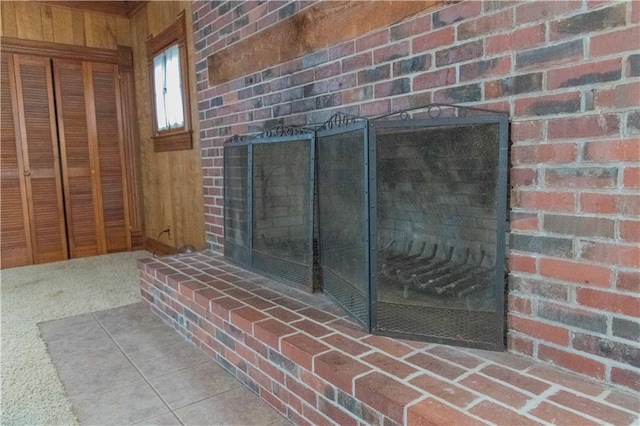 708 Osage St, Neodesha, KS 66757 - detailed view of a brick fireplace and wooden walls