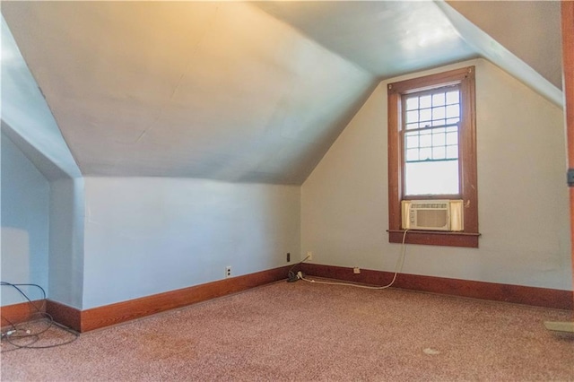 708 Osage St, Neodesha, KS 66757 - additional living space with cooling unit, carpet floors, and lofted ceiling