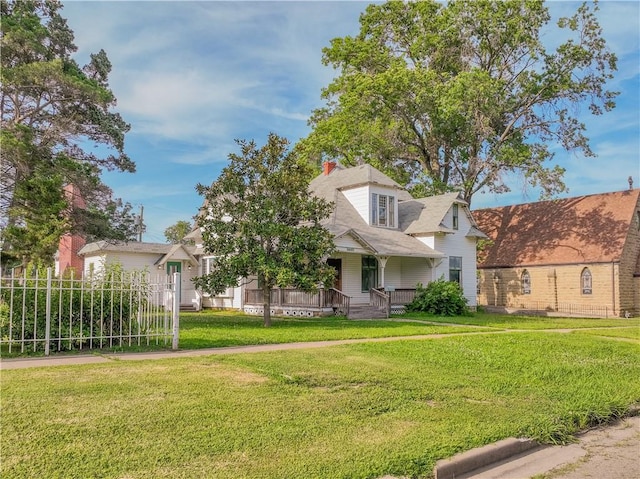 708 Osage St, Neodesha, KS 66757 - view of front of house featuring a porch and a front yard
