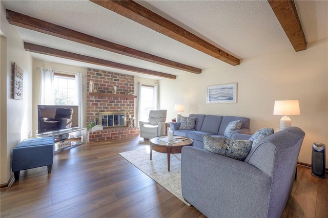7103 Mastin St, Merriam, KS 66203 - living room with beam ceiling, a brick fireplace, wood finished floors, and a textured ceiling