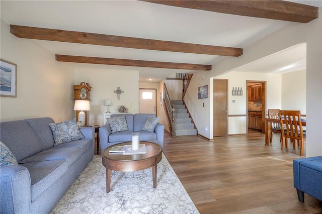 7103 Mastin St, Merriam, KS 66203 - living room with wood finished floors, beamed ceiling, and stairs