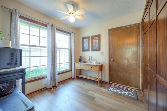 7103 Mastin St, Merriam, KS 66203 - doorway with light wood-type flooring and ceiling fan