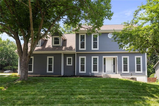 15614 Outlook St, Overland Park, KS 66223 - view of front of house featuring a front lawn and a shingled roof