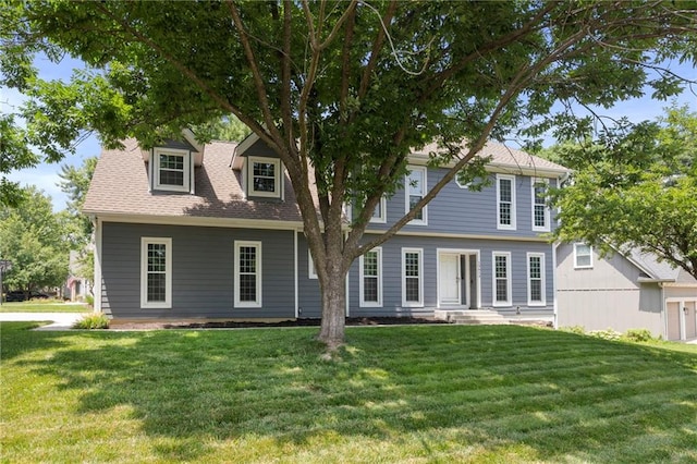 15614 Outlook St, Overland Park, KS 66223 - view of front of house featuring a front lawn and roof with shingles