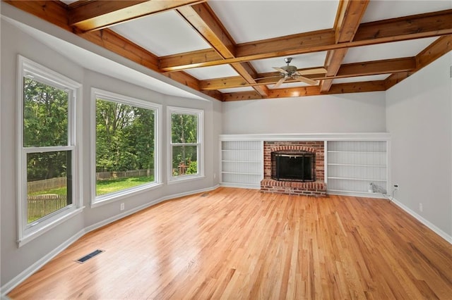 15614 Outlook St, Overland Park, KS 66223 - unfurnished living room featuring healthy amount of natural light, light wood-type flooring, coffered ceiling, beam ceiling, and ceiling fan