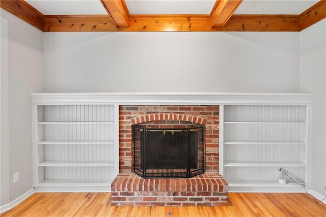 15614 Outlook St, Overland Park, KS 66223 - detailed view of wood finished floors, a brick fireplace, and beam ceiling