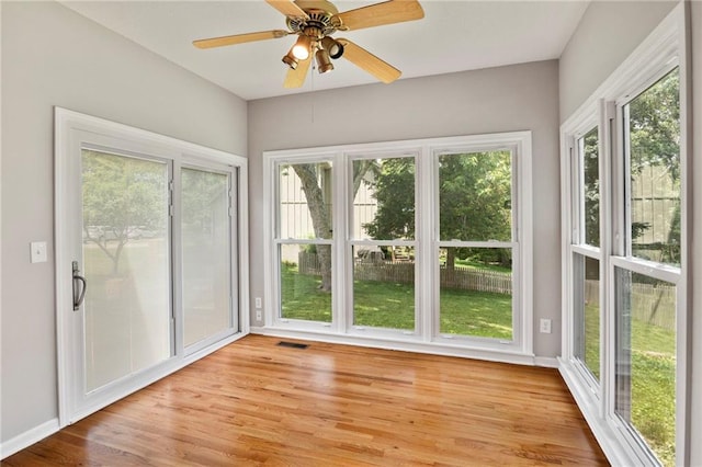 15614 Outlook St, Overland Park, KS 66223 - unfurnished sunroom with wood finished floors