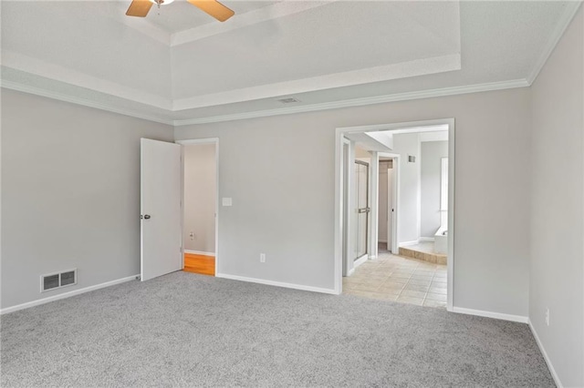 15614 Outlook St, Overland Park, KS 66223 - carpeted empty room with a raised ceiling, a ceiling fan, and crown molding