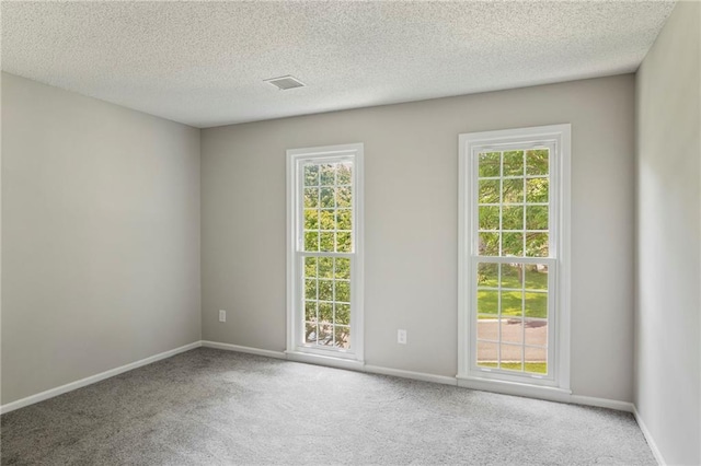 15614 Outlook St, Overland Park, KS 66223 - carpeted spare room featuring baseboards and a textured ceiling