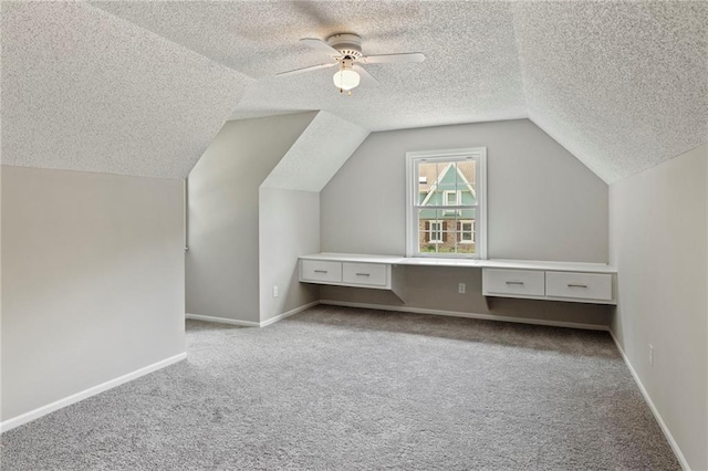 15614 Outlook St, Overland Park, KS 66223 - additional living space featuring a textured ceiling, carpet floors, lofted ceiling, and ceiling fan