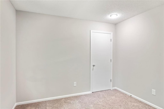 15614 Outlook St, Overland Park, KS 66223 - empty room featuring carpet floors and a textured ceiling