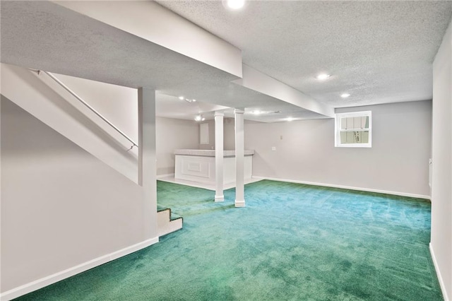 15614 Outlook St, Overland Park, KS 66223 - below grade area with carpet, a textured ceiling, recessed lighting, and stairway
