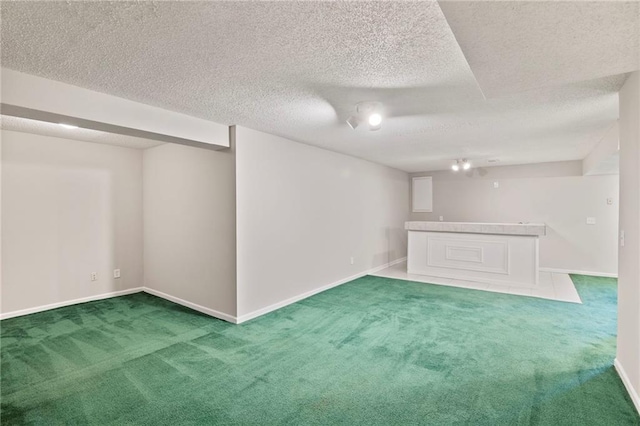 15614 Outlook St, Overland Park, KS 66223 - finished basement featuring carpet floors, bar, and a textured ceiling
