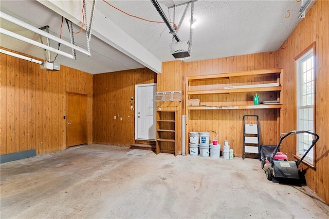 15614 Outlook St, Overland Park, KS 66223 - garage with wooden walls and a garage door opener