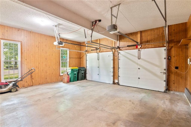 15614 Outlook St, Overland Park, KS 66223 - garage with a garage door opener and wood walls