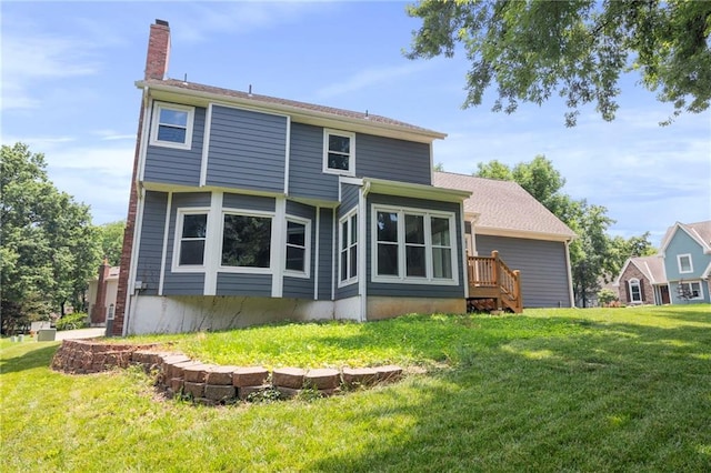 15614 Outlook St, Overland Park, KS 66223 - rear view of house featuring a yard and a chimney