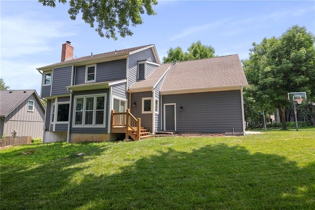 15614 Outlook St, Overland Park, KS 66223 - back of house featuring a chimney and a yard