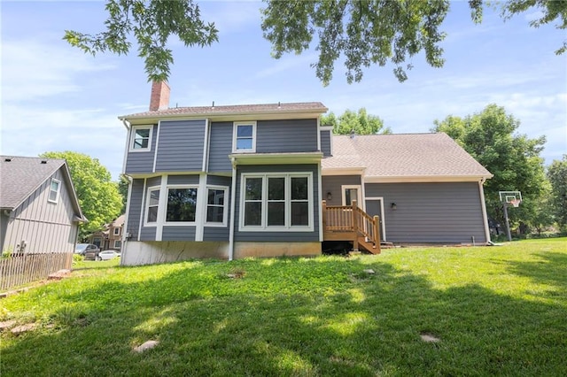 15614 Outlook St, Overland Park, KS 66223 - rear view of property with a yard and a chimney