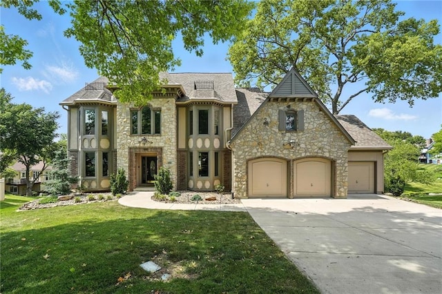 5806 W 130th St, Overland Park, KS 66209 - view of front of house with stone siding, concrete driveway, a front yard, and a garage