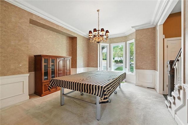 5806 W 130th St, Overland Park, KS 66209 - dining room with ornamental molding, light colored carpet, a chandelier, wainscoting, and a decorative wall