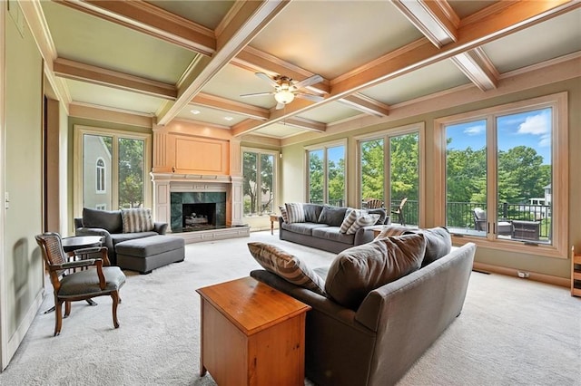 5806 W 130th St, Overland Park, KS 66209 - living area with light colored carpet, beamed ceiling, a ceiling fan, a premium fireplace, and coffered ceiling