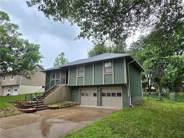 408 Creach St, Warrensburg, MO 64093 - view of front of home with an attached garage, stucco siding, stairway, and driveway