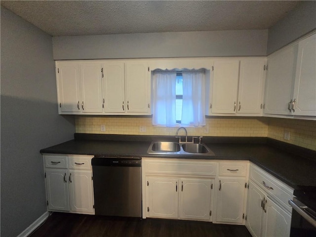 408 Creach St, Warrensburg, MO 64093 - kitchen with stainless steel dishwasher, dark countertops, white cabinetry, and a textured ceiling