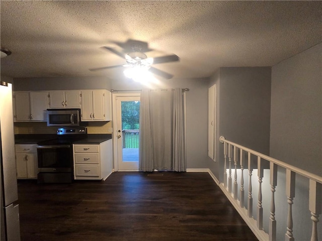 408 Creach St, Warrensburg, MO 64093 - kitchen with stainless steel appliances, dark wood-type flooring, dark countertops, a textured ceiling, and a ceiling fan