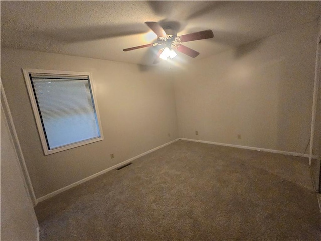 408 Creach St, Warrensburg, MO 64093 - empty room featuring carpet floors, ceiling fan, and a textured ceiling