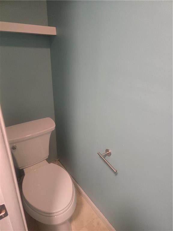 408 Creach St, Warrensburg, MO 64093 - bathroom featuring toilet and baseboards