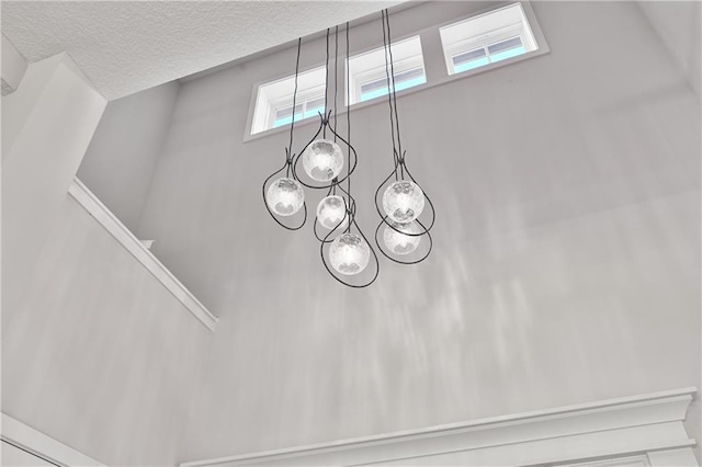 6126 Lewis Dr, Shawnee, KS 66226 - detailed view of a textured ceiling and a chandelier