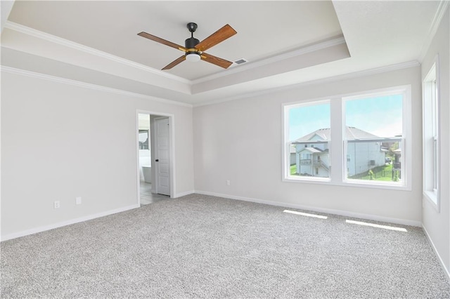 6126 Lewis Dr, Shawnee, KS 66226 - unfurnished room with a tray ceiling, ornamental molding, a ceiling fan, plenty of natural light, and light colored carpet