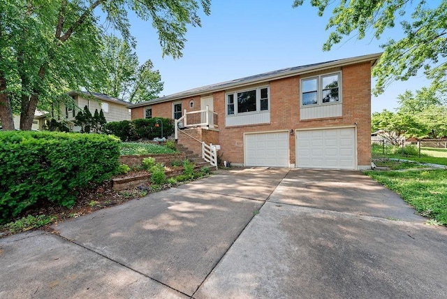 14224 E 36th St, Independence, MO 64055 - ranch-style house featuring concrete driveway, brick siding, and an attached garage