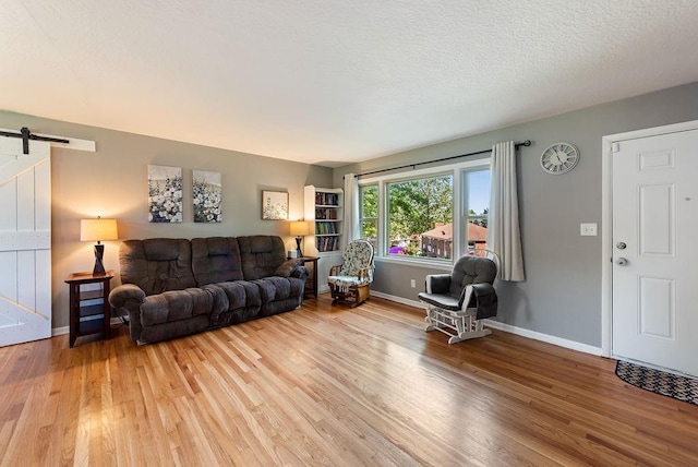 14224 E 36th St, Independence, MO 64055 - living room with a barn door and light wood-type flooring