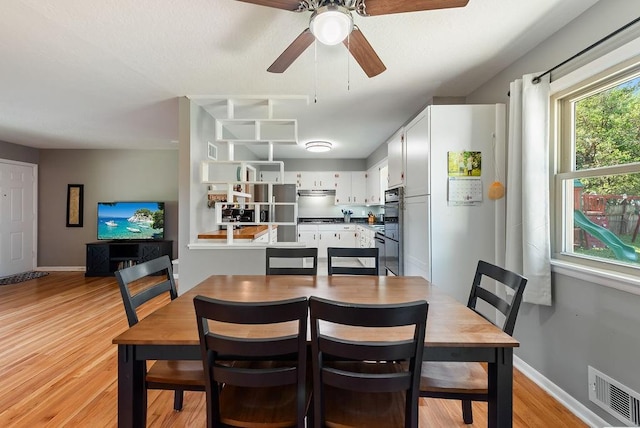 14224 E 36th St, Independence, MO 64055 - dining room with light wood-style floors and ceiling fan