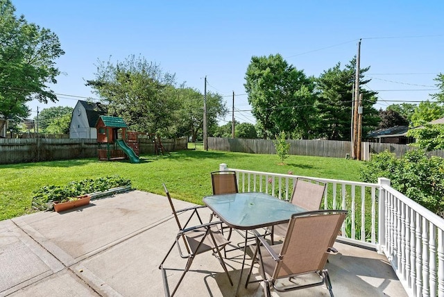 14224 E 36th St, Independence, MO 64055 - fenced backyard featuring outdoor dining area, a patio, and a playground