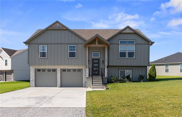 462 SE 90th Rd, Warrensburg, MO 64093 - view of front facade with an attached garage, a front lawn, board and batten siding, and concrete driveway