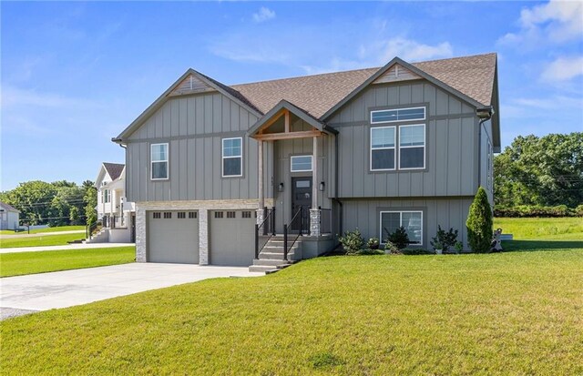 462 SE 90th Rd, Warrensburg, MO 64093 - view of front of home featuring a front yard, an attached garage, concrete driveway, board and batten siding, and a shingled roof
