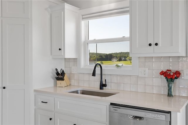 462 SE 90th Rd, Warrensburg, MO 64093 - kitchen featuring dishwashing machine, white cabinets, and light countertops