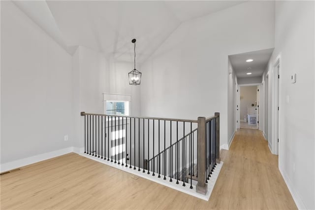 462 SE 90th Rd, Warrensburg, MO 64093 - hall with an upstairs landing, wood finished floors, a chandelier, and high vaulted ceiling