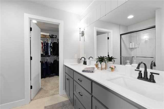 462 SE 90th Rd, Warrensburg, MO 64093 - bathroom featuring double vanity, a stall shower, tile patterned flooring, and a walk in closet